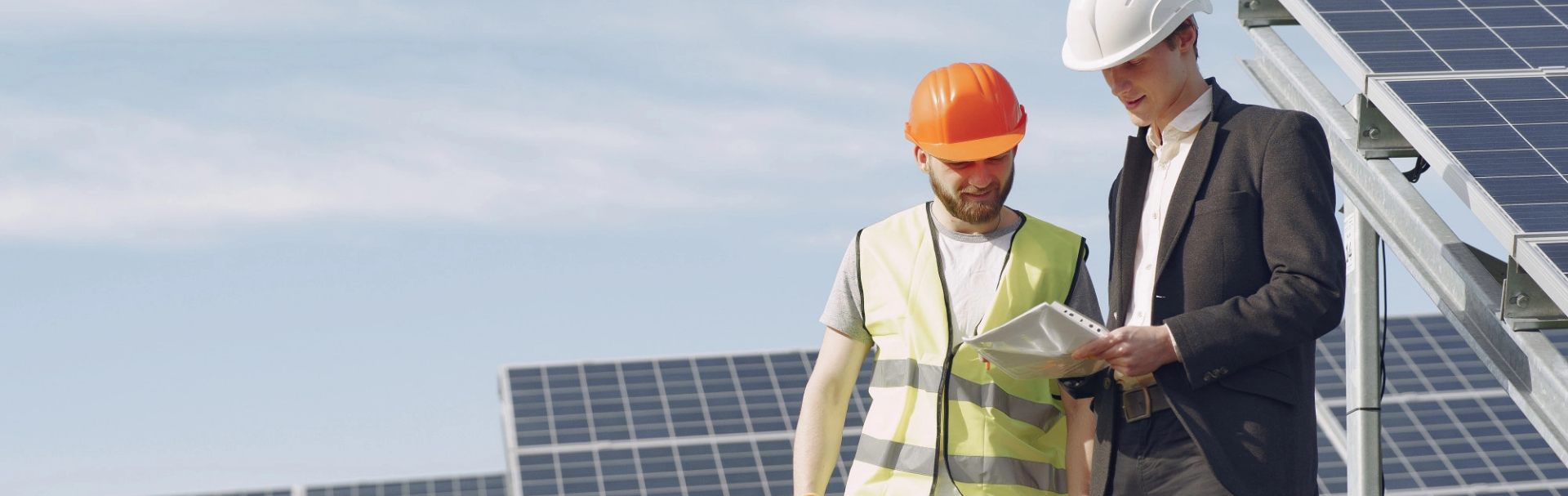 Solar installers working on panels